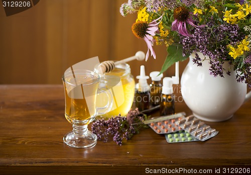 Image of medicinal herbs, honey, herbal tea