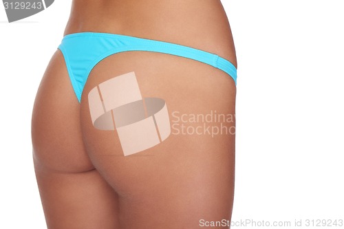 Image of Cropped buttocks of a woman in bikini