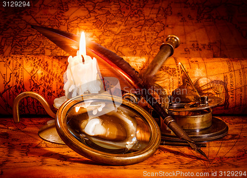 Image of Vintage still life. Vintage items on ancient map.