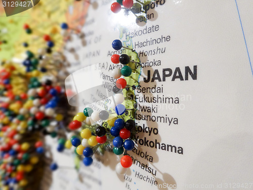 Image of pins over cities on japan map