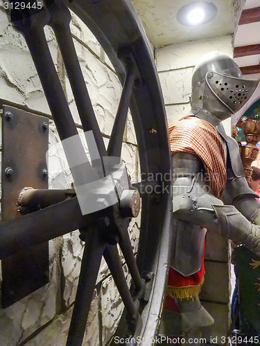 Image of ancient medieval collection of wheel and knight shield costume a