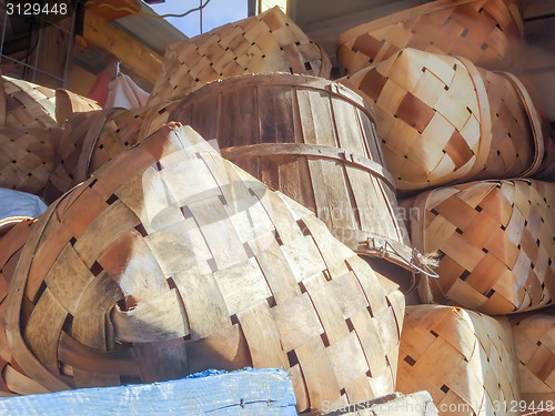 Image of pile of empty baskets stack on farm