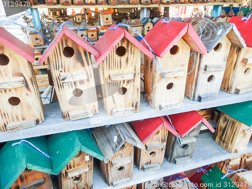 Image of array of handmade birdhouses for sale