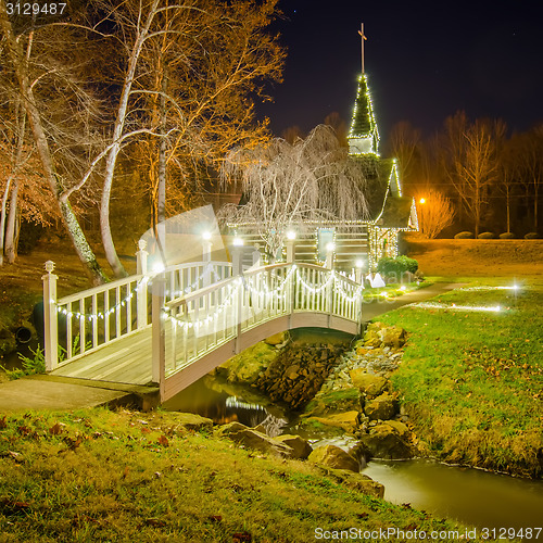 Image of tiny chapel with lighting at night