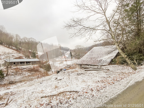 Image of winter shack and mountain  farm road