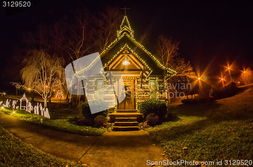 Image of tiny chapel with lighting at night