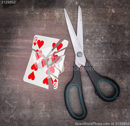 Image of Concept of addiction, card with scissors