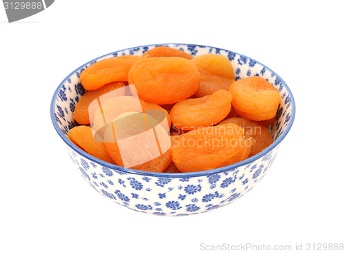 Image of Dried apricots in a blue and white china bowl