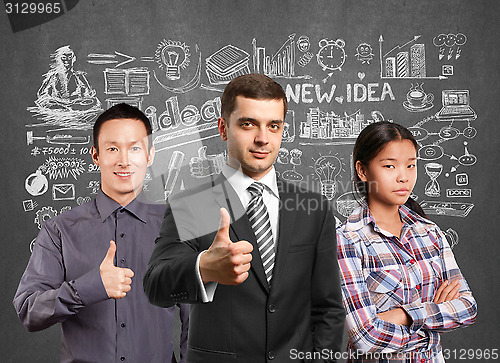 Image of Asian team and lamp head business people with laptops