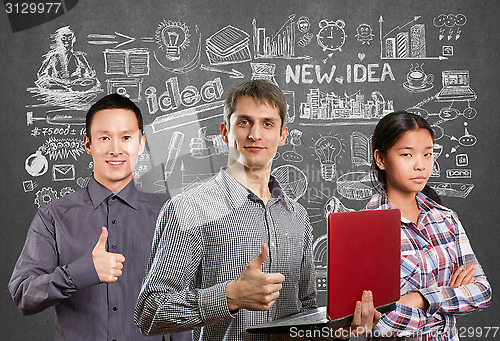 Image of Asian team and man with laptop in his hands and woman