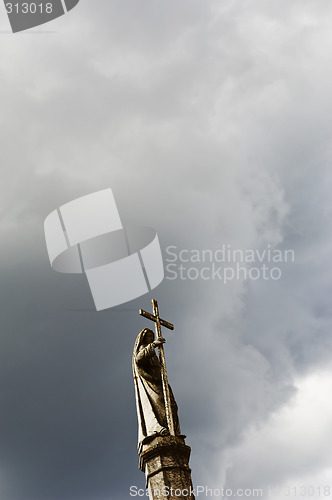 Image of Saint holding a cross