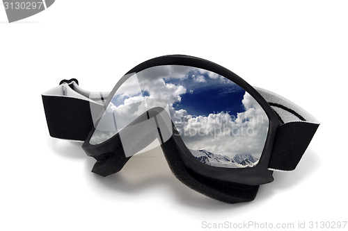 Image of Ski goggles with reflection of cloudy mountains