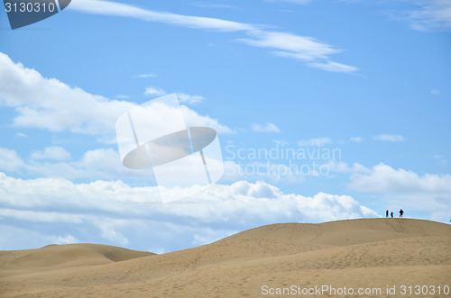 Image of Tourists sillhouettes at the dunes