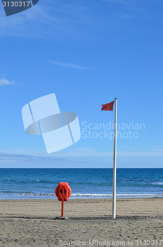 Image of Red flag and lifebuoy