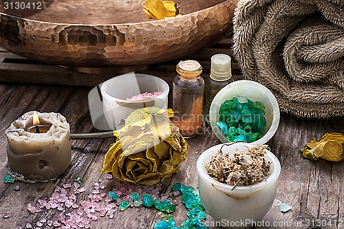 Image of bronze bowl with water and accessories spa treatments