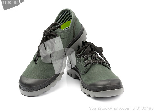 Image of Fashionable pair of green sneakers. Isolate on white.