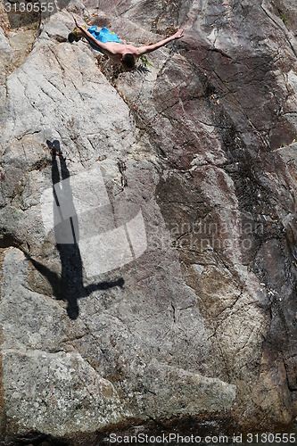 Image of Man jumping fish in water