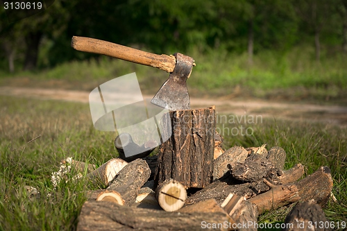 Image of Firewood and old axe