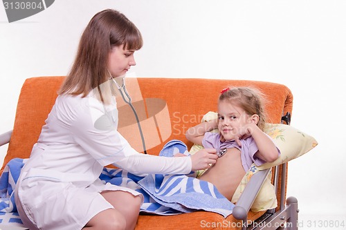 Image of Pediatrician listening stethoscope baby breast