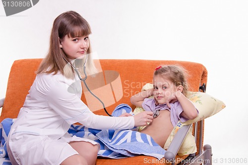 Image of Doctor listening stethoscope baby breath