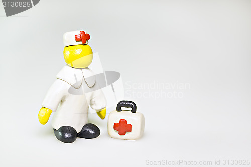 Image of Plasticine doctor with first aid kit 