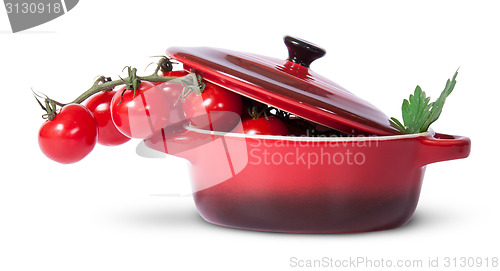 Image of Cherry tomatoes and parsley in saucepan with lid