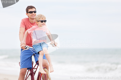 Image of family biking