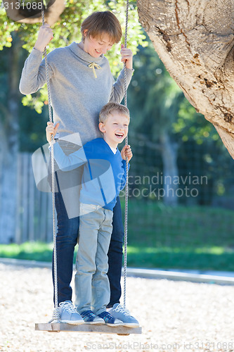 Image of family at swings
