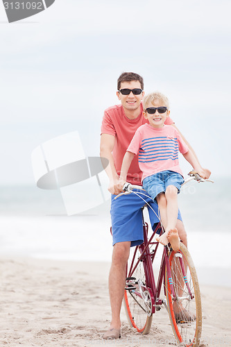 Image of family biking