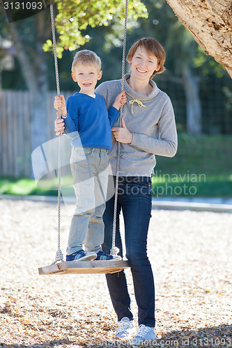 Image of family at swings