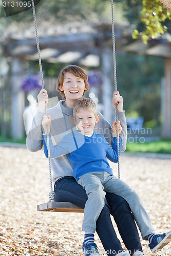 Image of family at swings