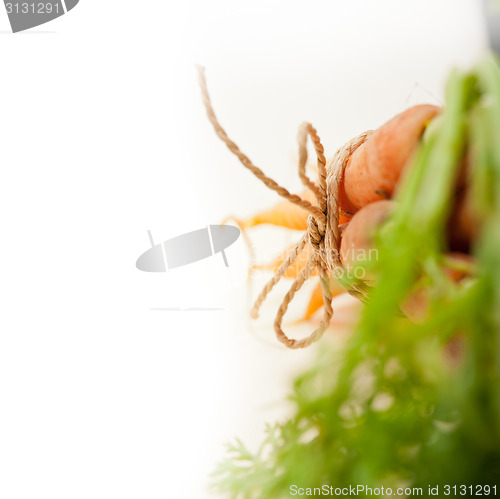 Image of baby carrots bunch tied with rope