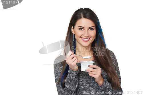 Image of Healthy woman eating yoghurt
