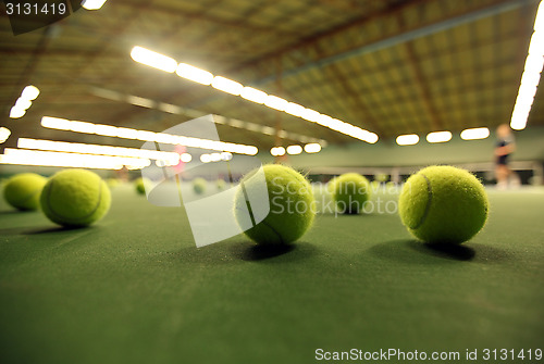 Image of tennis ball on a tennis court