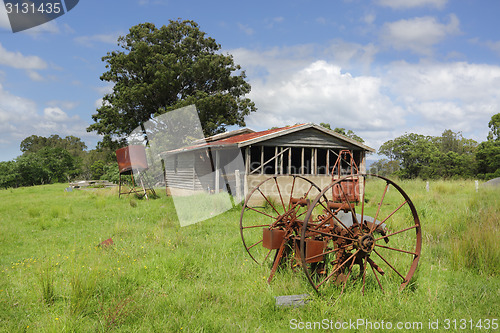 Image of Old derelict farm shed and rusty cart wheels at Benandarah