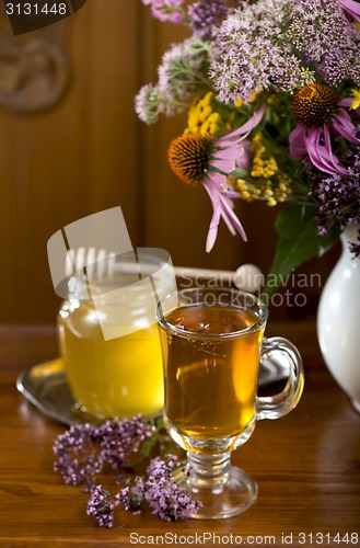 Image of medicinal herbs, honey, herbal tea