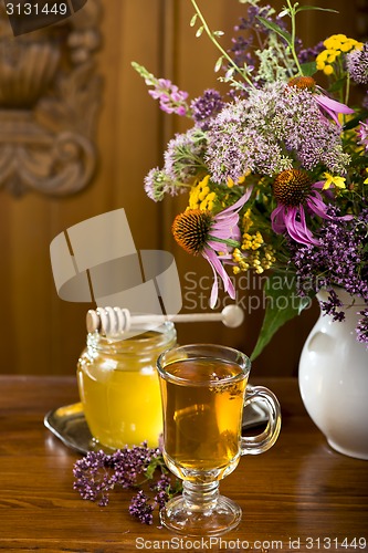 Image of medicinal herbs, honey, herbal tea