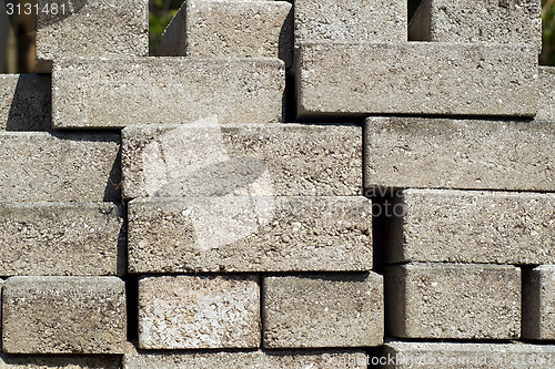 Image of stacked building bricks outside in sunshine