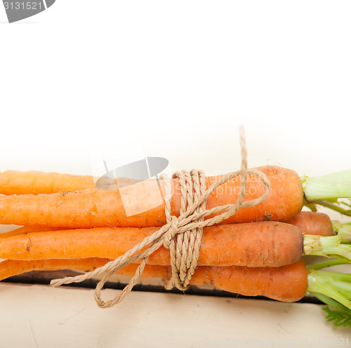 Image of baby carrots bunch tied with rope