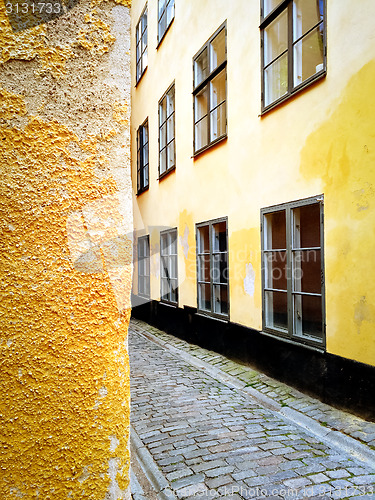 Image of Bright yellow buildings in the old center of Stockholm