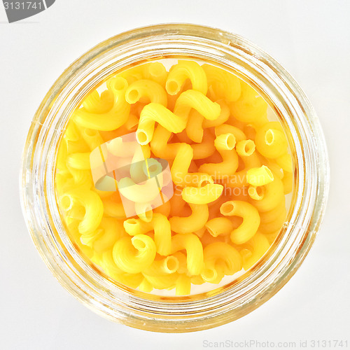 Image of Pasta in glass jar on white background