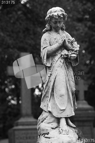 Image of A statue on a graveyard.