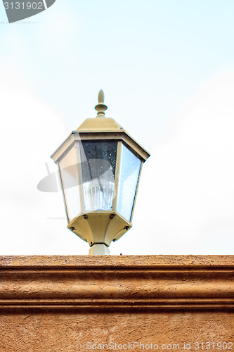 Image of old lamp on the wall 