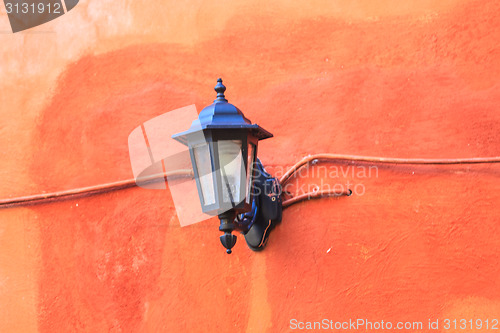 Image of old lamp on the wall 