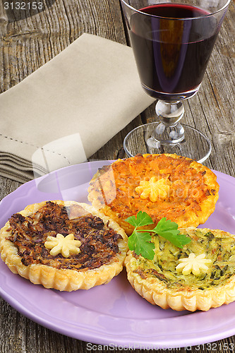 Image of Mini quiches and red wine