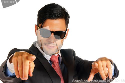 Image of Businessman with sunglasses pointing