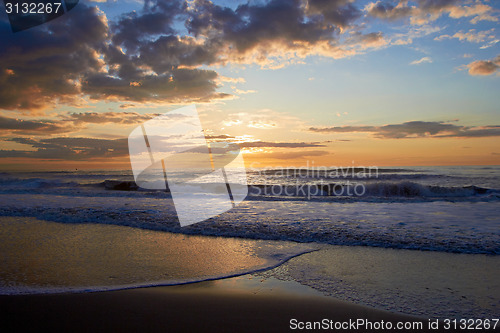 Image of Sunset over sea with clouds