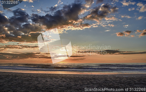 Image of Sunset over sea with clouds