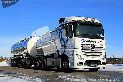 Image of White Mercedes-Benz Actros Tank Truck on Icy Yard