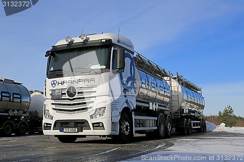 Image of White Mercedes-Benz Actros Tank Truck on Icy Yard